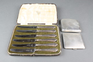 2 silver cigarette cases, 148 grams and a cased set of 6 silver handled butter knives 