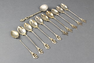 11 Continental silver gilt teaspoons with spiral stems, 136 grams 