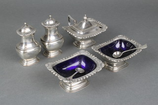 A 6 piece silver plated condiment set with gadroon and shell rims with 2 silver mustard spoons