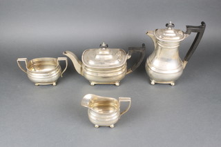 A silver plated 4 piece tea and coffee set of Georgian design with beaded decoration and ebony mounts