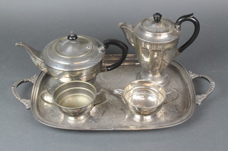 A silver plated Art Deco 3 piece tea set, a coffee pot and tray