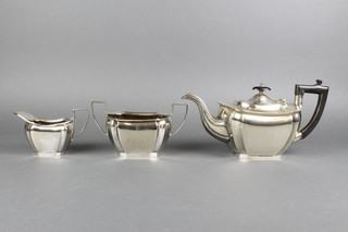 A silver plated 3 piece tea set with ebony mounts 