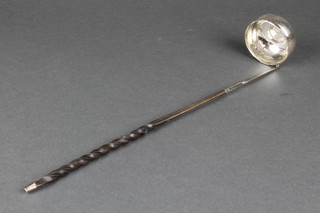 A Georgian silver toddy ladle with coin set base and whale bone handle 