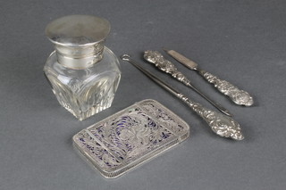 A Continental silver filigree card case, a silver topped toilet jar and 3 silver handled manicure implements 