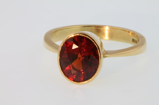 An 18ct gold gem set ring, size R 1/2