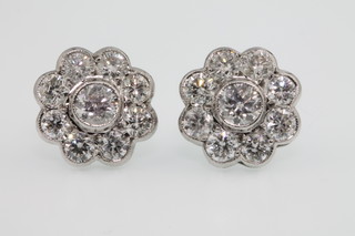 A pair of 18ct white gold 10 stone cluster earrings, approx 2.45ct 