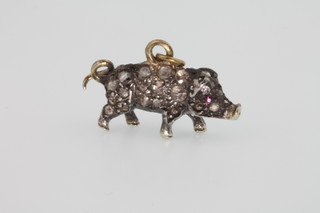 A gold diamond and ruby novelty pendant in the form of a pig 