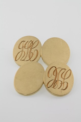 A pair of 18ct oval engraved cufflinks, 18 grams