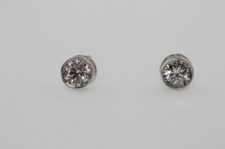 A pair of 18ct white gold single stone diamond ear studs, approx 0.45ct 
