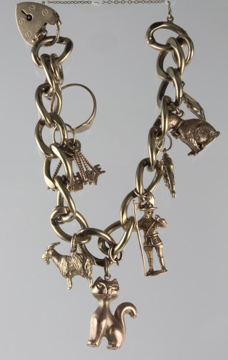 A 9ct gold charm bracelet with 8 charms, approx 56 grams