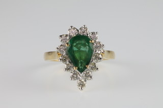 An 18ct yellow gold pear shaped emerald and diamond cluster ring, the centre emerald approx. 2.25ct, surrounded by 13 brilliant cut diamonds, approx. 1.01ct, size M 1/2
