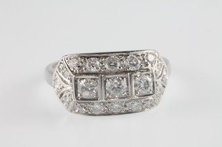 An 18ct white gold diamond Art Deco style ring, approx. 1.10ct, size O