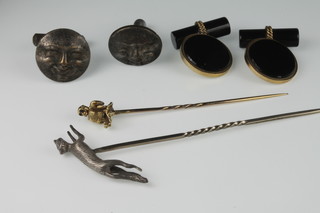 A gold novelty tie pin in the form of a monkey playing a drum, a silver ditto in the shape of a fox and 2 pairs of cufflinks