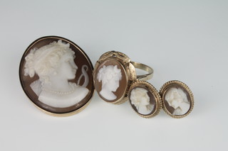 A suite of 9ct gold cameo jewellery comprising oval pendant, dress ring and ear studs 