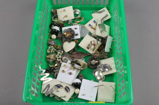 A quantity of earrings and studs together with a necklace and a quantity of charms
