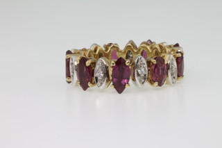 An 18ct ruby and diamond eternity ring consisting of 9 rubies and 10 diamonds, size L 1/2