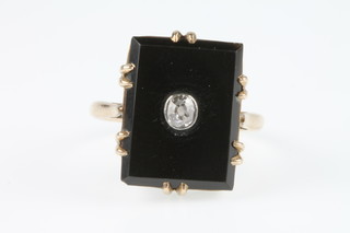An 18ct yellow gold diamond set black onyx up finger ring, size J 1/2 