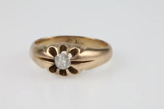 An 18ct gold single stone diamond gypsy set ring, size K 1/2