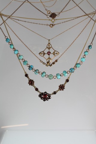 A Victorian matrix turquoise necklace, 2 others, a carved hardstone brooch and a gilt enamelled seal  