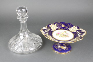 A cut crystal ships decanter 10", a Victorian blue and gilt tazza decorated with spring flowers 6" 