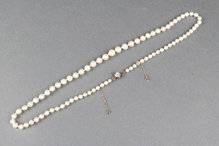 A cultured graduated pearl necklace with diamond and pearl set clasp 20" 