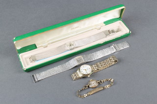 A lady's gilt Rotary wristwatch with mother of pearl dial and 3 others