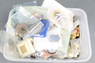 A collection of enamelled pin badges