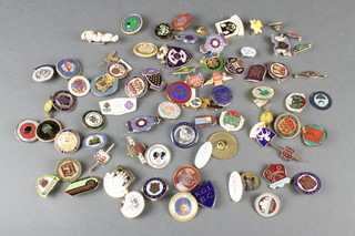 A quantity of enamelled pin badges