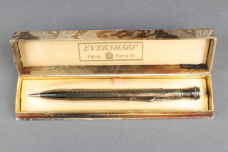 An engined turned silver propelling pencil