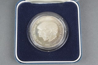 A 1981 silver commemorative crown and 1 other commemorative crown 