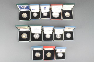 A collection of commemorative crowns and coins