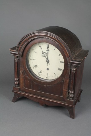 Roblin, Paris, an Edwardian French timepiece with 7 1/2" circular dial painted Roman numerals contained in an oak arch shaped case, raised on bracket feet