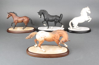 4 porcelain horse figures - Fury of the Plains 10", a rearing white stallion 10", a black race horse 10" and a brown race horse 10" 