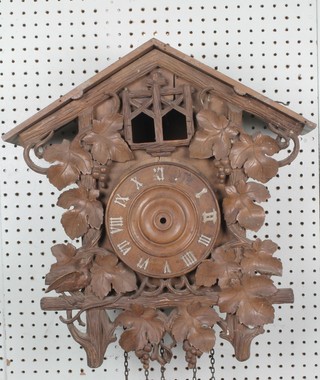 A carved wooden cuckoo clock case, requires some attention 