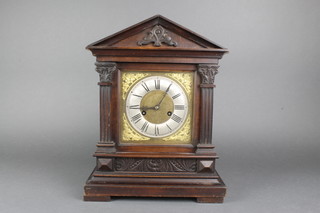 An Edwardian striking bracket clock with gilt dial, silvered chapter ring and Roman numerals, contained in a walnut case 