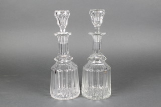 A pair of Edwardian mallet decanters with faceted bodies 12" 