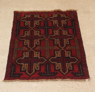 A red and blue ground Belouche rug with 6 stylised gulls to the centre 27" x 34" 