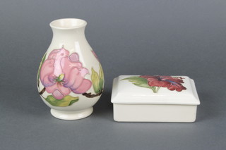 A Moorcroft baluster vase decorated with peony on a cream ground 5", a ditto rectangular box and cover 4"