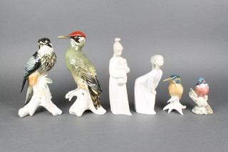 4 Continental figures of birds - a woodpecker 10", falcon 10" and 2 woodpeckers 3" 