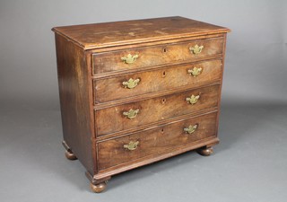 A Georgian mahogany chest of 4 long drawers, raised on bun feet with brass plate handles 31"h x 34"w x 19 1/2"d 