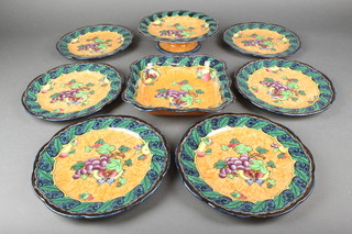 A Losol ware Armado dessert service comprising square dish, comport and 6 plates decorated with fruits 