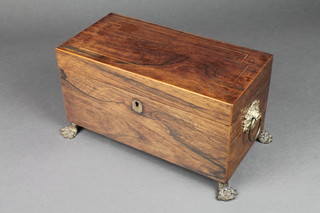 A Regency rectangular inlaid rosewood twin compartment tea caddy with hinged lid, fitted 2 caddies and bowl receptacle, having brass ring drop handles to the side and raised on paw feet 6 1/2"h x 12"w x 6"d 