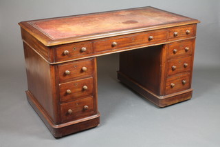 A Victorian mahogany pedestal desk with brown leather skiver, fitted 1 long and 8 short drawers 29"h x 54"w x 30"d