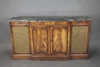 A Regency style breakfront mahogany sideboard with green veined marble top, fitted a pair of cupboards enclosed by panelled doors and flanked by a pair of cupboards enclosed by grilled panelled doors, raised on a platform base 35"h x 68"w x 14"d 