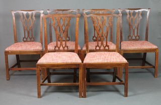 A set of 6 19th Century mahogany Chippendale style slat back dining chairs with upholstered drop in seats, raised on square supports, with H framed stretcher