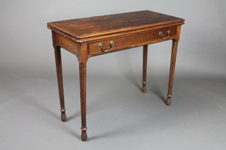 A 19th Century rectangular mahogany card table, fitted a frieze drawer and raised on turned and fluted supports 28 1/2"h x 36"w x 16"d 