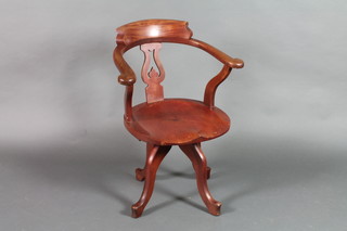 A Victorian mahogany swivel office chair, raised on 4 splayed supports