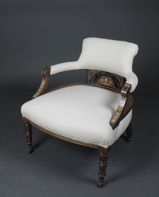 An Edwardian mahogany tub back chair inlaid ivory and satinwood stringing, the seat and back upholstered in white material, raised on turned supports