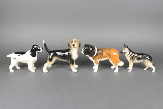 4 Beswick figures of dogs - Corner Garth Stroller 7", a beagle 7", a blue roan spaniel 6" and a German shepherd dog 5" 