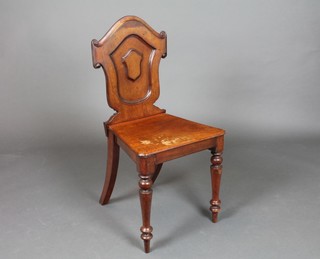 A Victorian mahogany hall chair with shield shaped back and solid seat, on turned supports 16"h